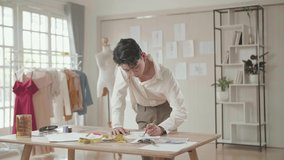 Young Asian Male Fashion Designer Drawing Pencil Sketches
 - Powered by Shutterstock - Get 15% off with code: PIKWIZARD15