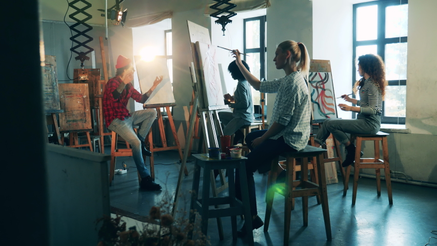 Art school with a group of women learning how to paint. Art education concept. Royalty-Free Stock Footage #1071372622