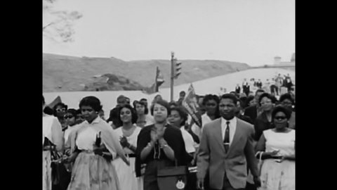 CIRCA 1960s - Congressman Charles Diggs collects petitions and citizens march in protest for Civil Rights in 1960.