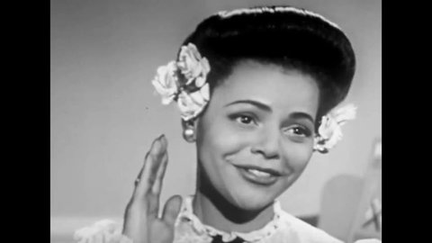 CIRCA 1940s - A black woman sings a 1940s ballad about a rocking horse in this 1940s soundie musical.