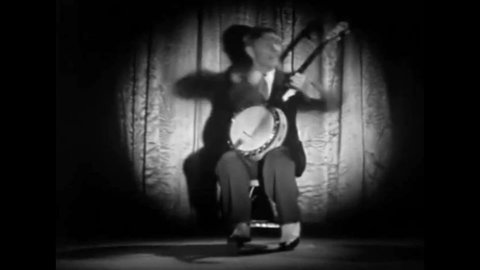 CIRCA 1940s - Eddie Peabody plays American banjo classics in 1942.