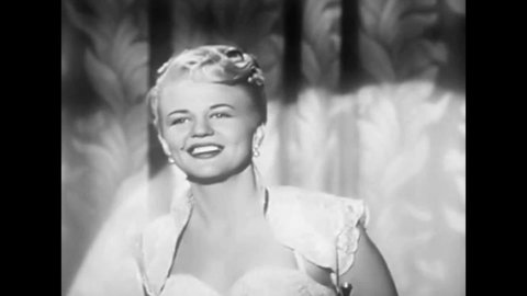 CIRCA 1940s - Peggy Lee concludes a performance of "Why Don't You Do Right?"