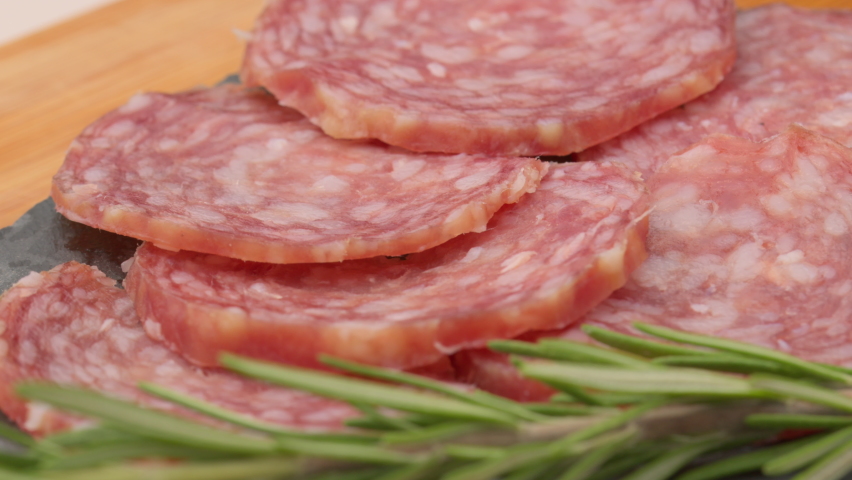Sliced sausages rotation. Sliced salami rotates. Smoked sausage slices.  Salami Rotating. Sausage isolated.  | Shutterstock HD Video #1071389149