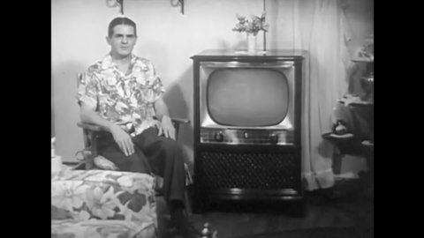 CIRCA 1950s - Appliance store owners talk about their great new televisions and a consumer sits in his living room, in the 1950s.