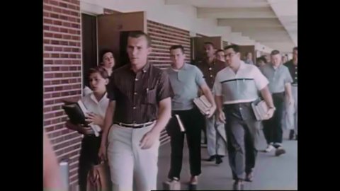 CIRCA 1960s - College students leave their classrooms in the 1960s.