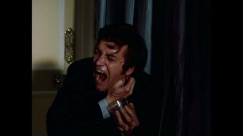 CIRCA 1972 - In this horror film, a man starts to transform into a vampire.