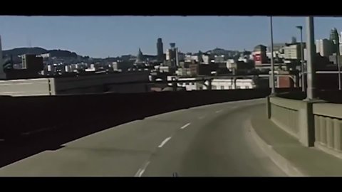 CIRCA 1955 - Cars drive over the Bay Bridge into San Francisco, California.
