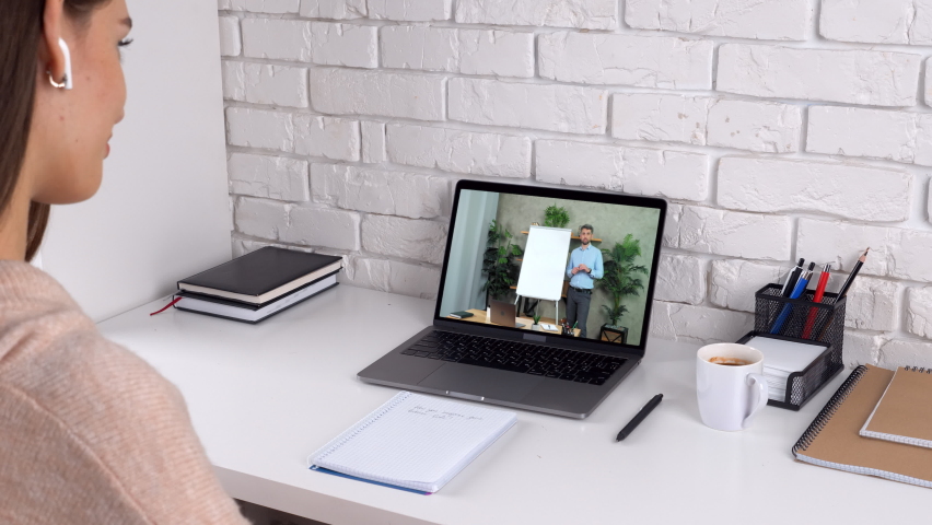 Woman student at home listen watch study online webinar master class course laptop webcam, drink coffee tea. Distance man teacher tutor near whiteboard greets tells teaches remote video call chat - Powered by Shutterstock - Get 15% off with code: PIKWIZARD15