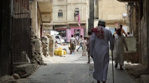 Taiz  Yemen - 23 June 2020 : Yemeni youth brings water due to the water crisis and the difficult living conditions witnessed by residents of the Taiz city in southern Yemen since the beginning of the