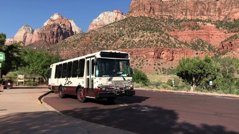 Zion National Park, Utah- July 2018: Zion National park free shuttle bus rolls into the parking lot