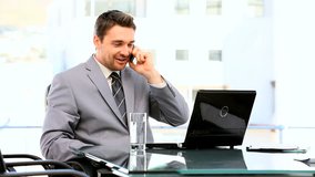 Businessman having a phone call at his desk