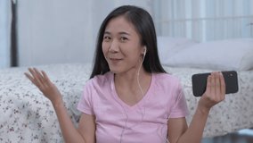 Holiday concept of 4k Resolution. Asian women are giving fun interviews at home.