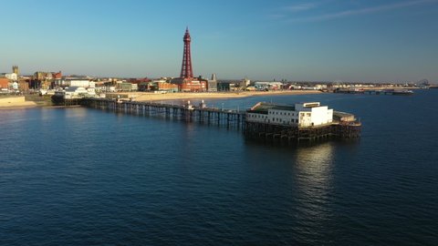 4K: Aerial Drone Video of Blackpool, England, UK. Flying low over the sea towards the pier and The Tower. Stock Video Clip Footage