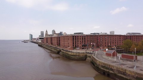 Liverpool, Merseyside, UK - April 20th, 2021: 4K Albert Dock aerial with views of the Liverpool skyline