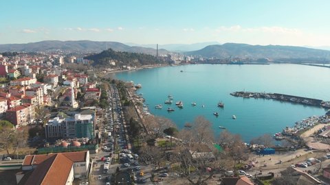 Aerial Cinematic footage clip: Drone flying over Karadeniz, Eregli the home of Erdemir, an important steel plant of Turkey. large natural harbour, located in the lee of Baba Burnu. Zonguldak, Turkey.