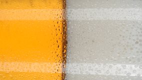 beer in glass close up and rotation. glass of beer with foam. vertical video. 4K UHD video - Powered by Shutterstock - Get 15% off with code: PIKWIZARD15