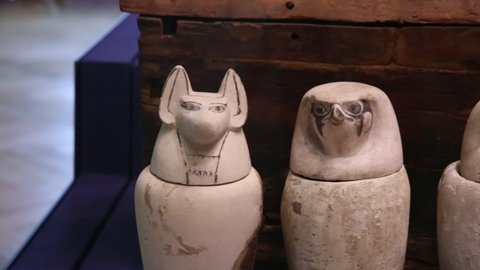 Cracow, Malopolska, Poland - 04.18.2021: Egyptian canopic jars to hold a mummy`s internal organs. National Museum Krakow. Czartoryski Collection. Ancient art artifacts.