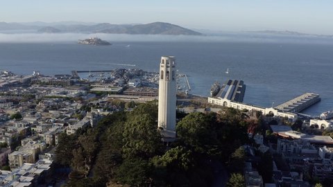 Aerial, San Francisco Coit Tower and cityscape, panning right drone 