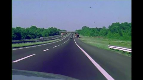 CIRCA 1960s - Amateur footage shot from the front of a car driving towards the Pennsylvania Turnpike in 1968.