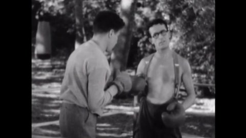 CIRCA 1936 - In this comedy movie, a boxing trainer is exasperated by a timid student.