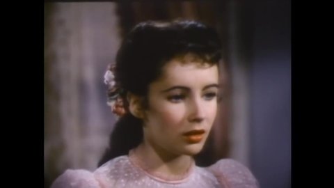 CIRCA 1947 - In this comedy movie, an Episcopalian boy on the violin tries to play a hymn with a Methodist girl (Elizabeth Taylor) on the piano.