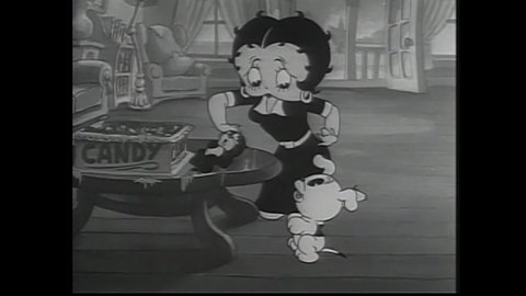 CIRCA 1936 - In this animated film, Betty Boop sings on the piano for Pudgy and they find a kitten that's gotten sick from eating too much candy.