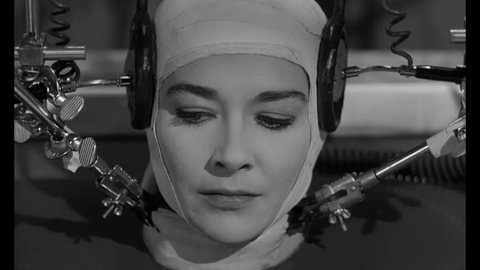 CIRCA 1962 - In this sci-fi film, a scientist warns a woman's disembodied head that there is something even more disturbing than her in the lab.