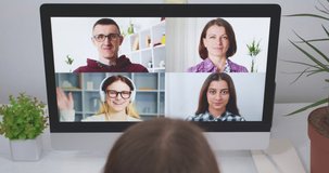 Online consultation, conversation with a group of people with a computer screen. Remote video call with friends, family or colleagues. Educational webinar for students using a webcam. 4K.