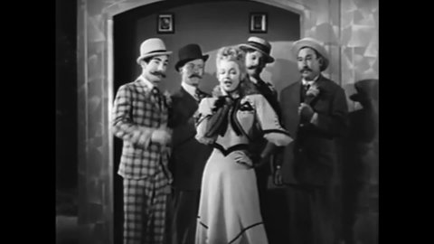 CIRCA 1944 - In this musical, a woman concludes a performance on stage with a barbershop quartet.