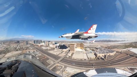 CIRCA 2020 - U.S. Air Force cockpit footage of Thunderbird jet fighter plane and pilot aerial acrobat team flight, Las Vegas NV.