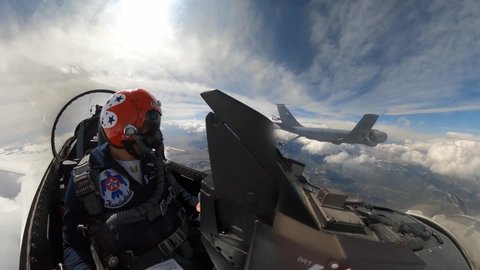 CIRCA 2020 - U.S. Air Force cockpit footage of Thunderbird jet fighter plane aerial acrobat team refueling in flight, Denver CO.