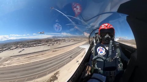 CIRCA 2020 - U.S. Air Force cockpit footage of Thunderbird jet fighter plane and pilot aerial acrobat team flight, Las Vegas NV.