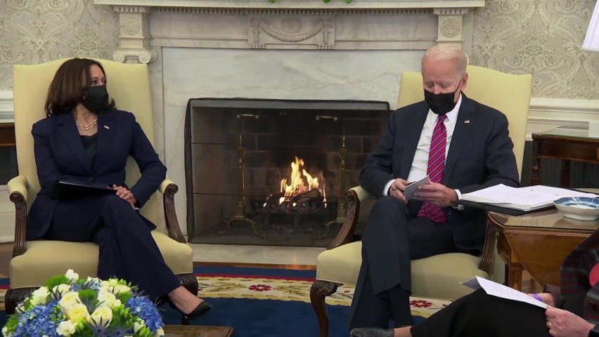 CIRCA 2020s - U.S. President Joe Biden reads notes about pandemic economic crisis while U.S. Vice President Kamala Harris sit.