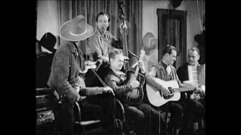 CIRCA 1937 - In this western film, Tex Ritter and the Texas Tornadoes perform "I'm a Natural Born Cowboy" in a saloon.