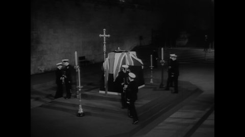CIRCA 1965 - The changing of the guard takes place inside Westminster Abbey, where Winston Churchill is lying in state.