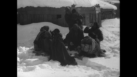 CIRCA 1932 - US Army planes drop supplies to snowbound Navajo and Zuni peoples in Arizona.