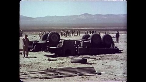 CIRCA 1951 - American soldiers inspect damage done to tanks and other military vehicles after an A bomb test in the desert.