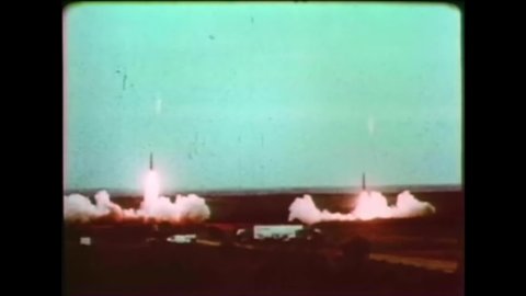 CIRCA 1960s - Small rockets are launched by the US military at a testing site.