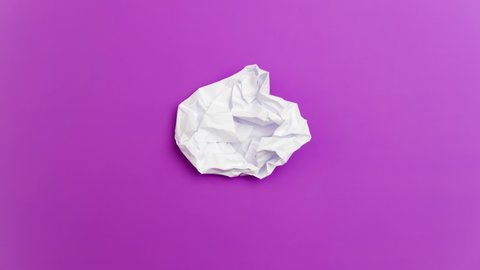 Stop Motion Animation_White paper ball unwrapping on a purple background