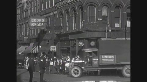 CIRCA 1919 - British vehicles drive through New York City.