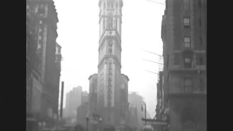 CIRCA 1919 - Traffic passes by the Flatiron Building in New York City.