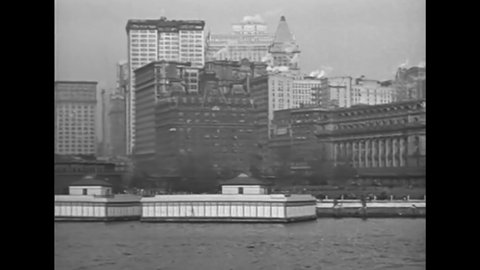CIRCA 1919 - A boat cruises around New York harbor.