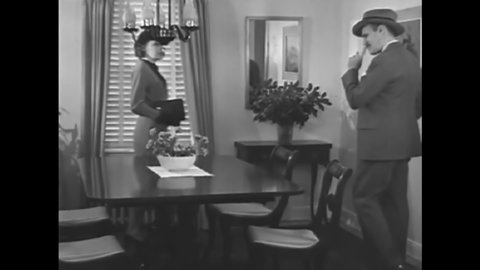 CIRCA 1935 - A couple tours a model home, which the wife is much more excited about than the husband.