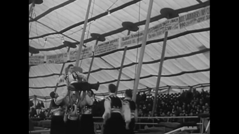 CIRCA 1950s - Acrobats perform at a circus.