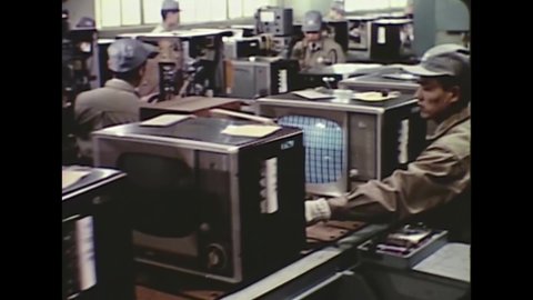 CIRCA 1963 - Television sets are mass produced at a factory in Japan.
