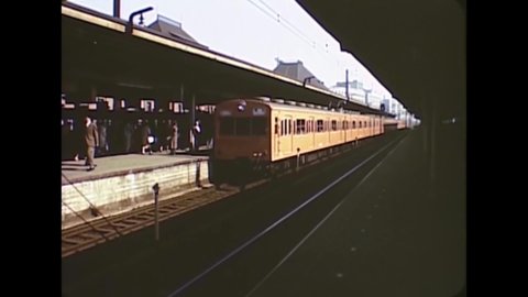 CIRCA 1963 - Commuter trains run through Tokyo, Japan.
