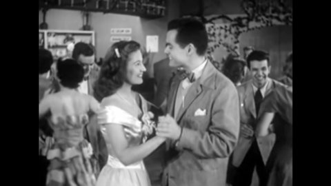 CIRCA 1950 - A teenage boy is angry when he comes to a dance and sees the girl who turned him down dancing with someone else. He cuts in.