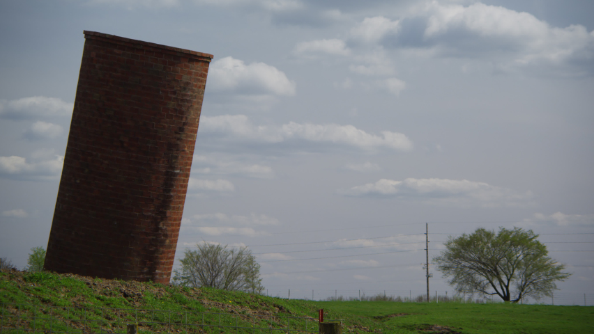 Leaning grain silo defies physics and battles gravity in Iowa farm country