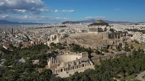 Aerial drone video of magnificent Acropolis hill and the Parthenon with great views to Plaka district and whole urban city of Athens, Attica, Greece