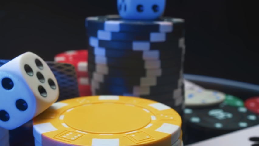 Casino chips and playing cards in motion. Concept of gambling or poker and entertainment. Close up macro shoot | Shutterstock HD Video #1071462892